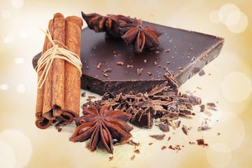 Closeup of chopped chocolate, cinnamon and anise