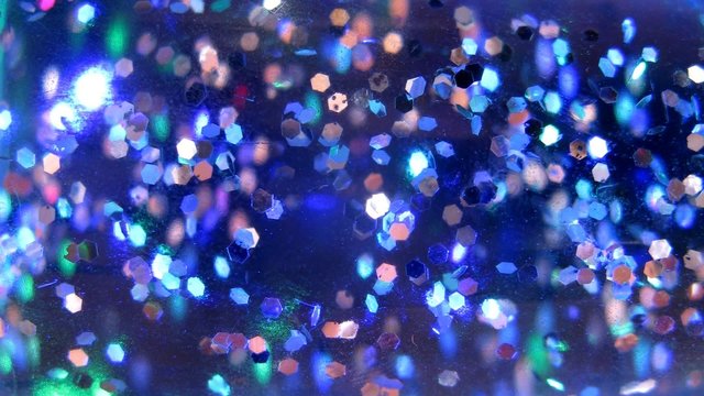 Particles in night lamp start to fly and shine different colors