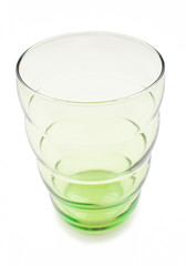 Green glass cup on white