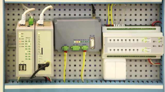 panel of devices with sockets and blinking bulbs
