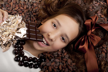 girl with chocolate on cocoa background
