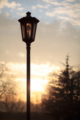 Fototapeta na wymiar lamp post with sunset