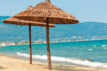 Umbrellas on the beach with mountan and ocean