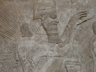Ancient Assyrian wall carving of a man