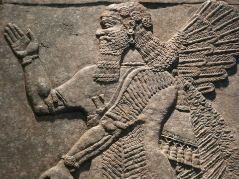 Ancient Assyrian wall carving of a man