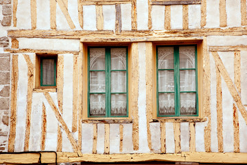 Fototapeta na wymiar Windows of medieval timberframe house in Dinan, Brittany
