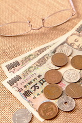 japanese yen (ten thousand money) with eyeglasses