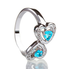 beautiful ring with blue precious stones isolated on white