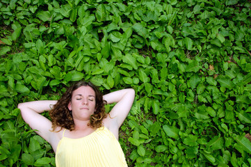 Woman resting in meadow