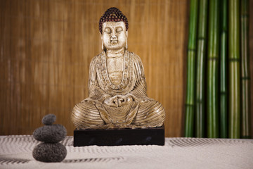 Still life with buddha statue and bamboo