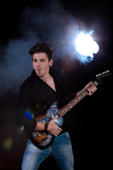 Cool man with electric guitar