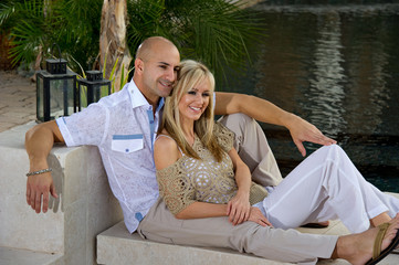 Couple lounging by the pool