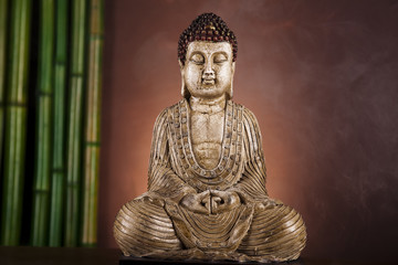 Fototapeta premium Still life with buddha statue and bamboo