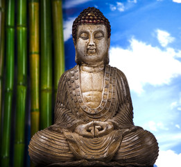 Still life with buddha statue and bamboo