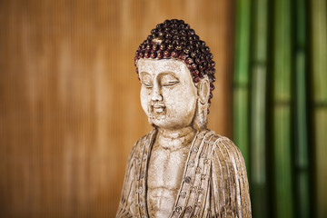 Still life with buddha statue and bamboo