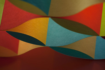 curved, colorful sheets paper with mirror reflexions