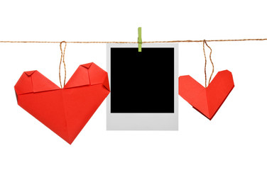 Blank photo frame with origami hearts on rope