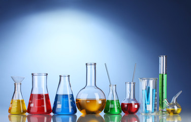 Different laboratory glassware with color liquid and with