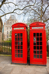 Fototapeta premium Two red telephone box outside the natural history museum. London