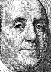 Extreme close-up of one hundred bill Franklin portrait.
