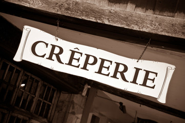Fototapeta premium Creperie sign on historic house in Dinan, Brittany