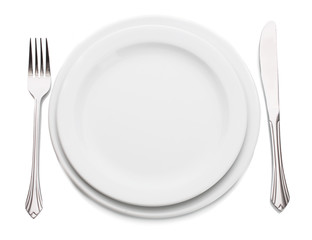 White empty plate with fork and knife isolated on white