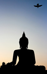 Silhouette of buddha statue