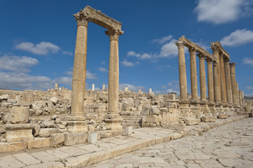 Ancient vertical columns with capital along the Roman road in Je