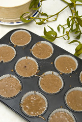 Raw dough into muffins in the forms