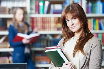 young student girl study with book in library