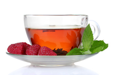 black tea in cup, mint and raspberry isolated on white
