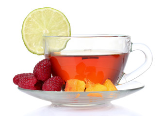 black tea in cup, lime, peach and raspberry isolated on white