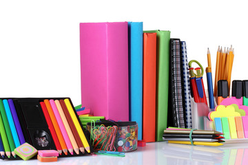 bright stationery and books isolated on white