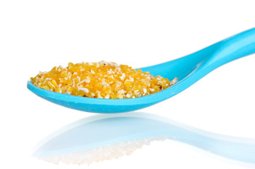 corn grits in blue plastic spoon isolated on white