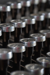 Old typewriter keyboard with silver and black round keys.