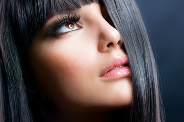 Fashion Brunette. Beautiful Makeup and Healthy Black Hair