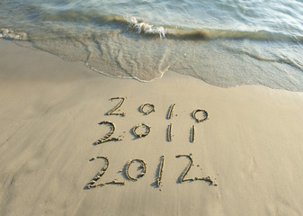 2012 new year message on the sand beach