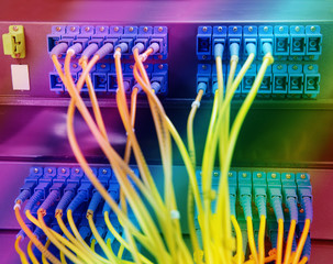 shot of network cables and servers in a technology data center