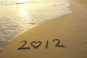 2012 new year message on the sand beach