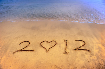 2012 new year message on the sand beach