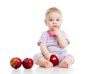 Baby boy eating healthy food isolated