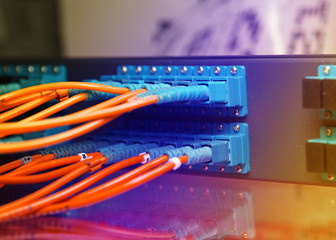 optic fiber cables connected to an optic switch .