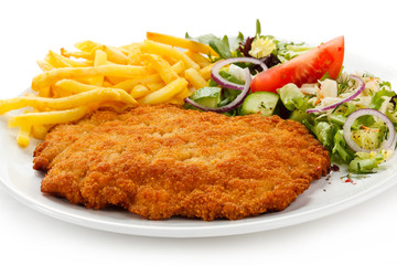 Pork chop, French fries and vegetables