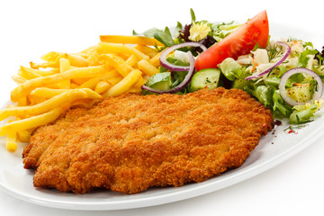 Pork chop, French fries and vegetables