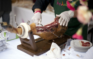 Jamon iberico (prosciutto) ham slicing