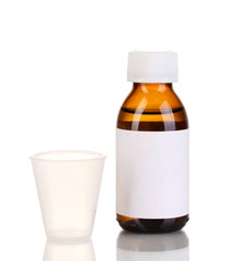 Medical bottle and jigger isolated on white