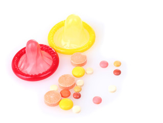 birth condoms and control pills isolated on white