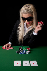 Attractive woman playing poker