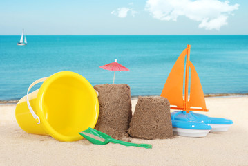 Sand castle with toys