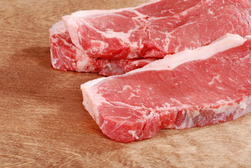 Strip loin steak on wood